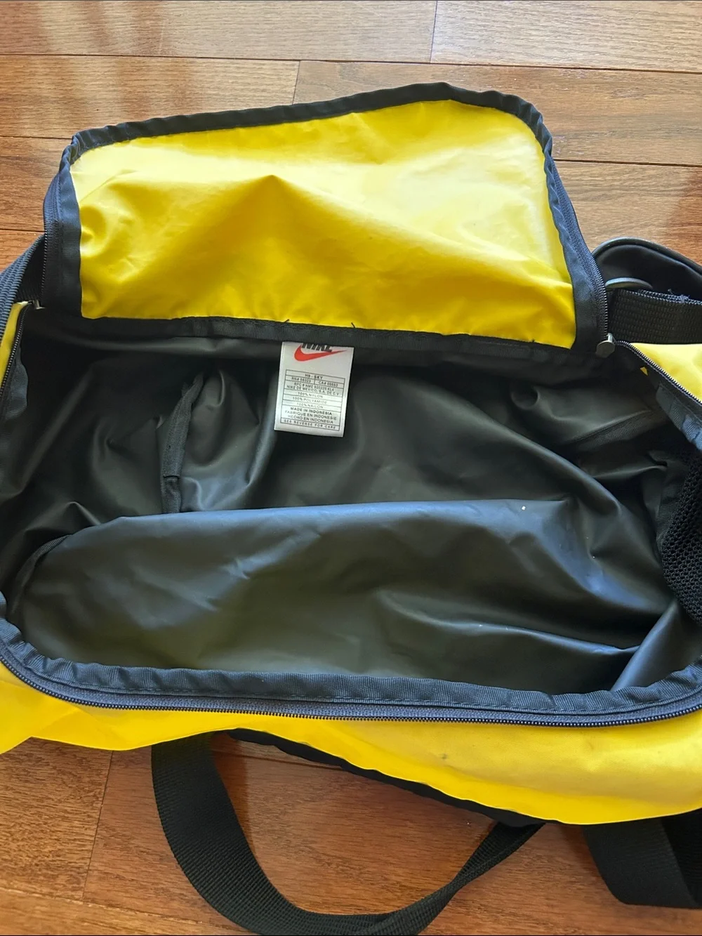 Vintage Nike Black and Yellow Duffel Bag with Logo Stripe